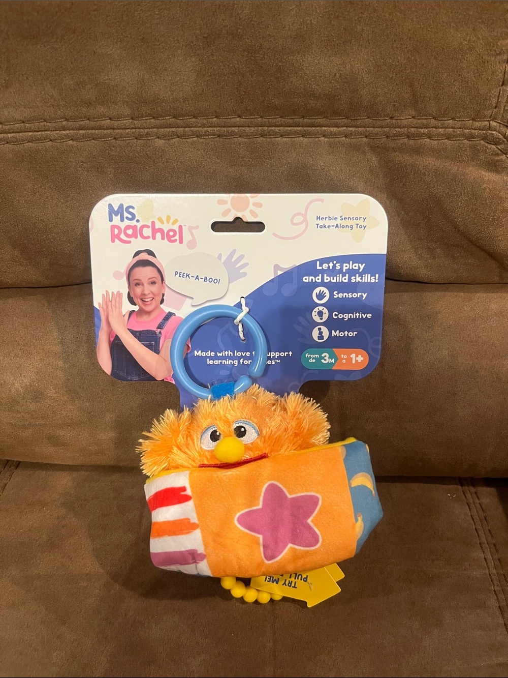 Rachel Orange Plush Sensory Take-Along Toy with Blue Clip